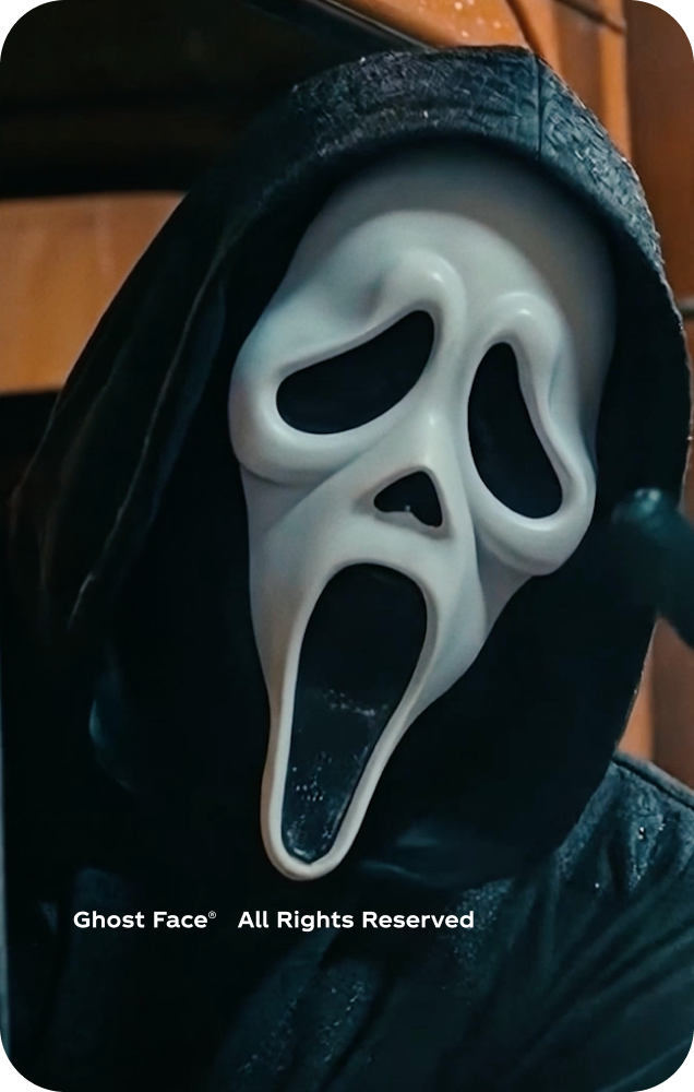 Ghost Face character in a dark setting for the Fanta Halloween promotional card.