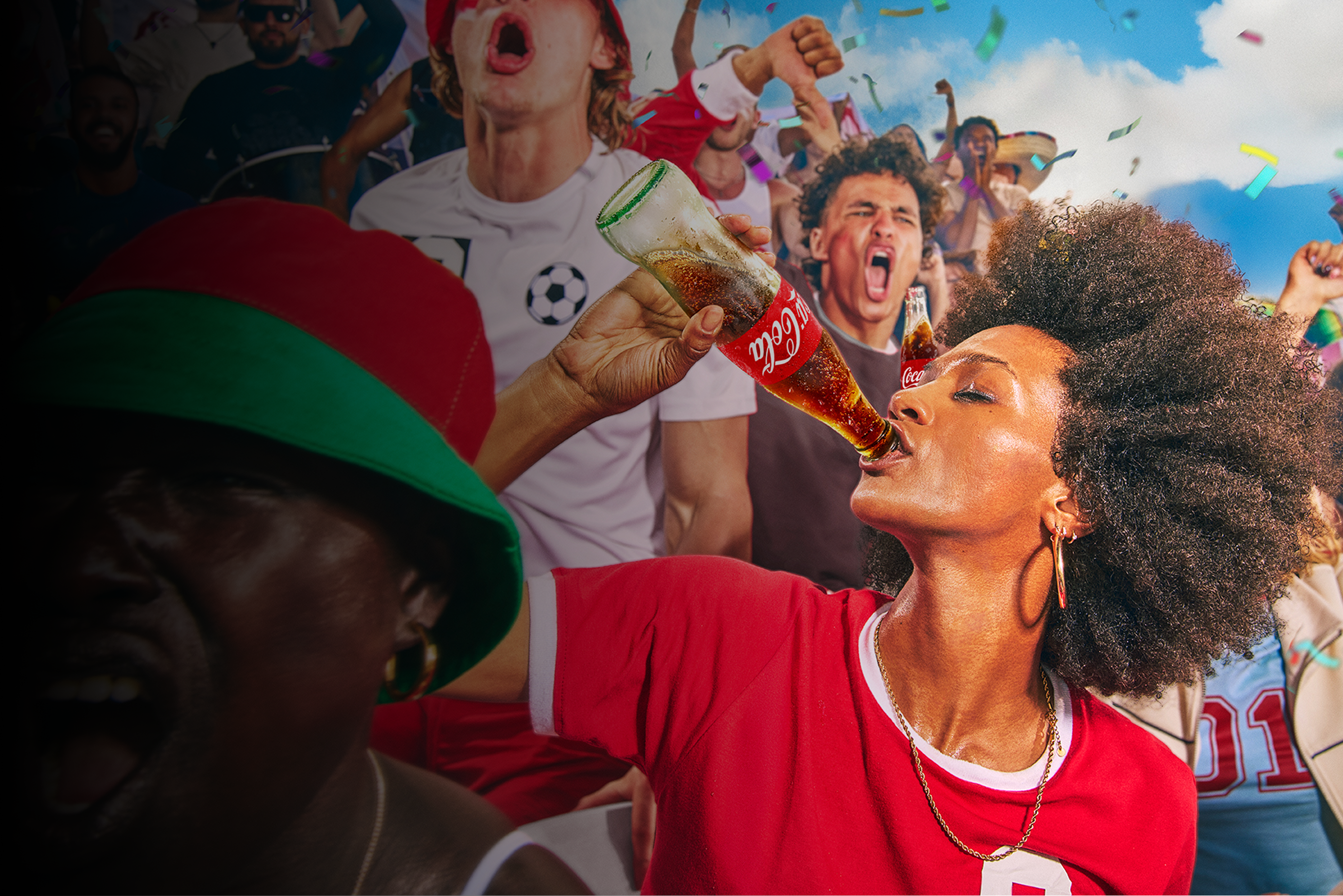 Soccer fans in stadium celebrating with confetti as woman in red shirt drinks Coca‑Cola from glass bottle.