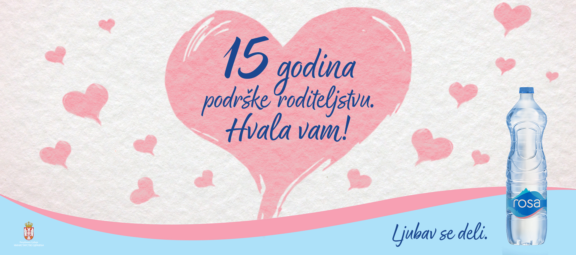 Veliko ružičasto srce sa porukom o 15 godina i flaša vode „Rosa“ na desnoj strani.