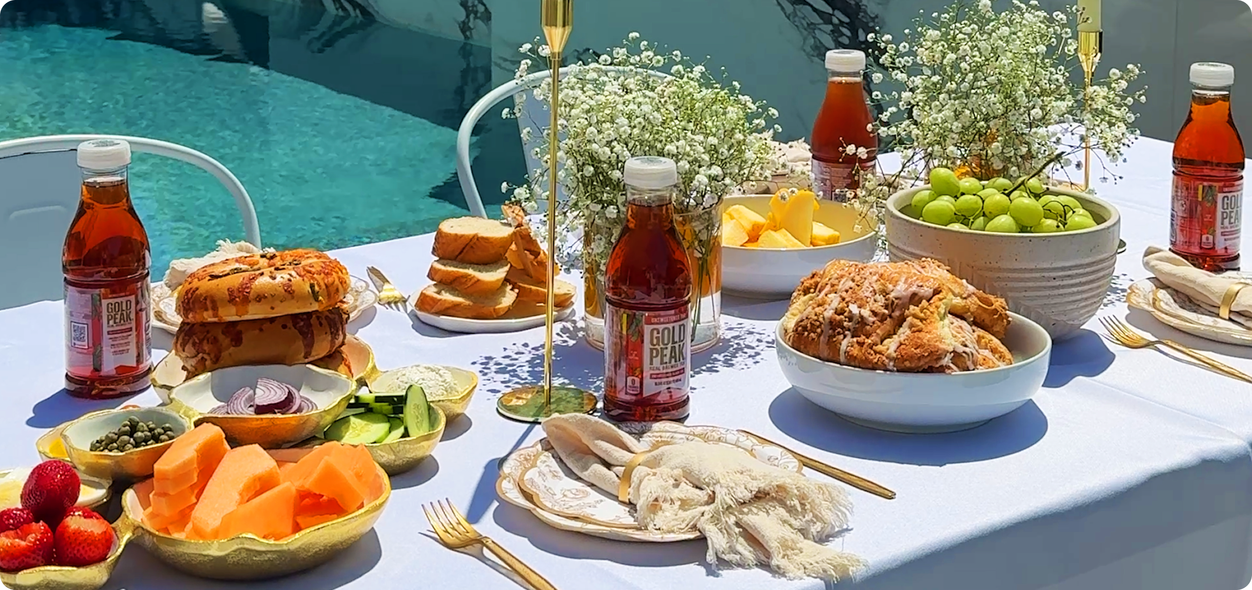 Gold peak tea drinks sitting on a table with food