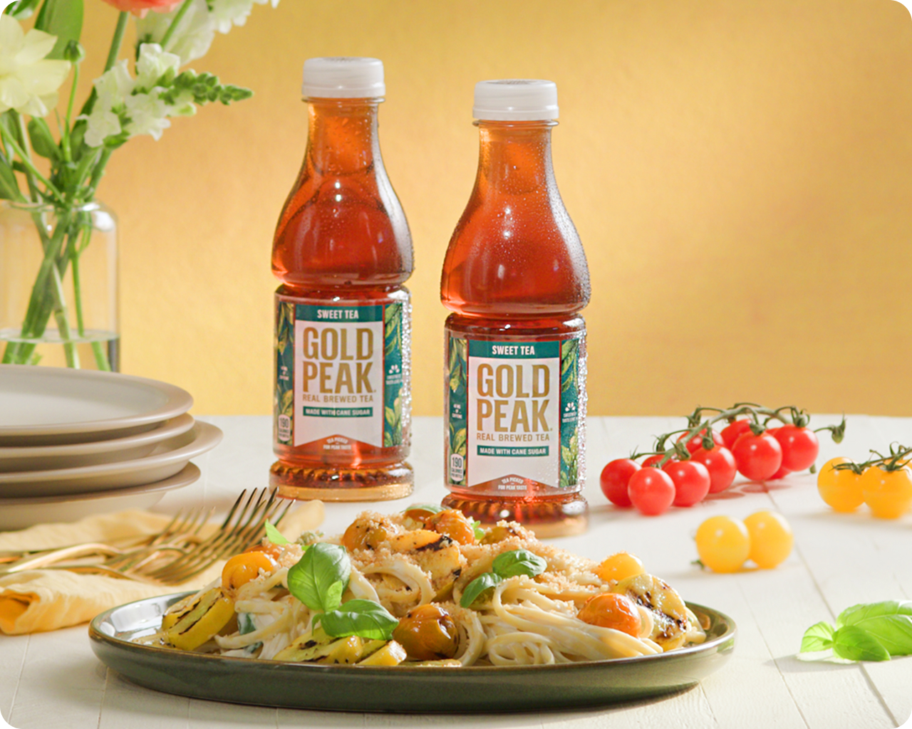 two gold peak bottles and food