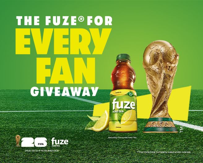 Fuze lemon iced tea bottle beside FIFA World Cup trophy on soccer pitch promoting Every Fan giveaway.