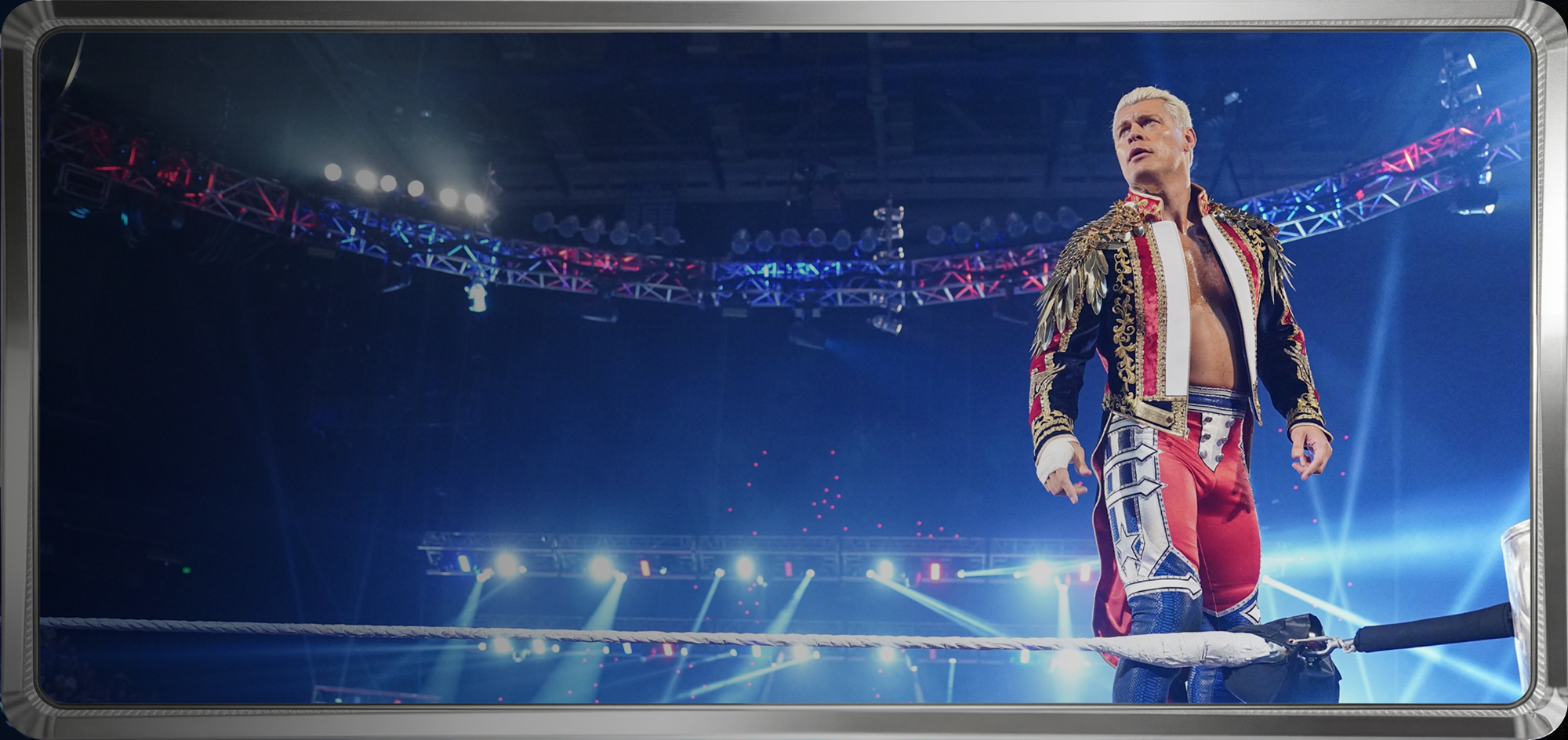 Minute Maid x WWE prize details banner with wrestler in ornate red and blue gear standing on ring ropes under bright arena lights.